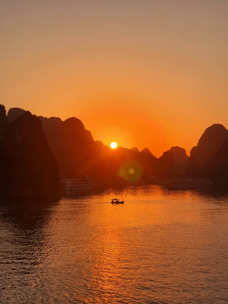 Beautiful sunset on Ha Long Bay archipelago