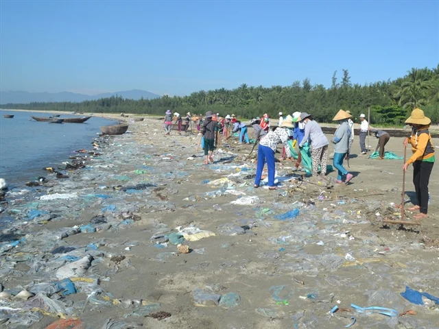 Hội An Women's Union conducting beach cleanup to reduce plastic pollution in Vietnam.